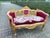 Late 20th Century French Louis XVI–Style Gilded Beech Settee in Red Velvet Elevate your interior with this striking late...