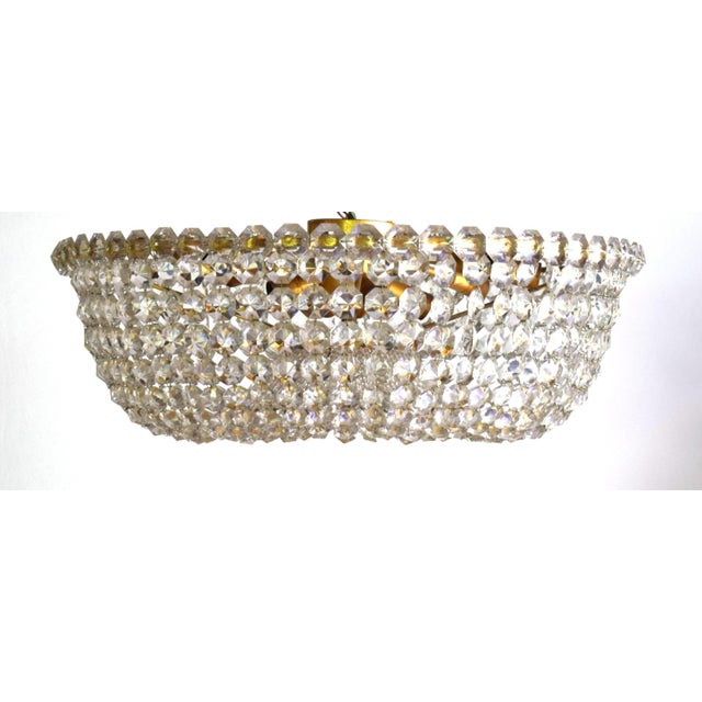 Large basket chandelier. Model is listed in the Lobmeyr catalog. 12 E14 fuel oils This piece is attributed to the...