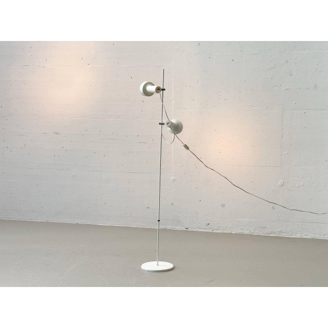 A beautifully designed floor lamp with two individually adjustable spotlights, elegantly reflecting the functional design...