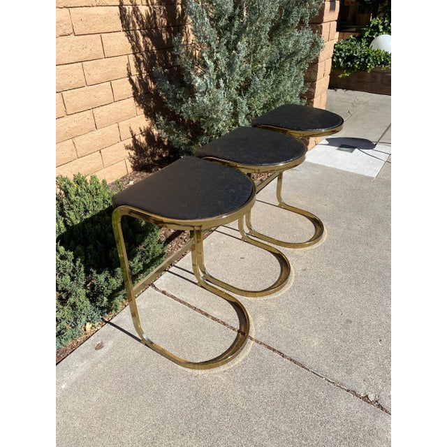 Trio of Mid Century brass stools floral embossed black vinyl upholstery Perfect for your Mid Century Ranch