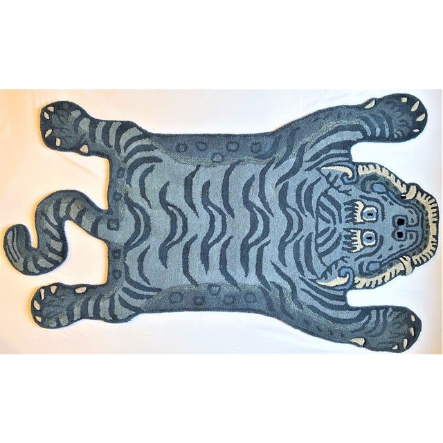 This is a whimsical rug in the shape of Tibetan Tiger. It is called a Persian hunting rug and they are often done with...