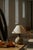 Decorative Danish ceramic table lamp from the 1970s, featuring a hand-crafted floral motif with sunflowers and leaves in...