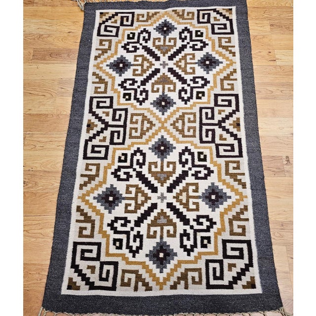 Discover the profound cultural richness and earthy beauty of this Vintage American Southwestern Area Rug, meticulously...