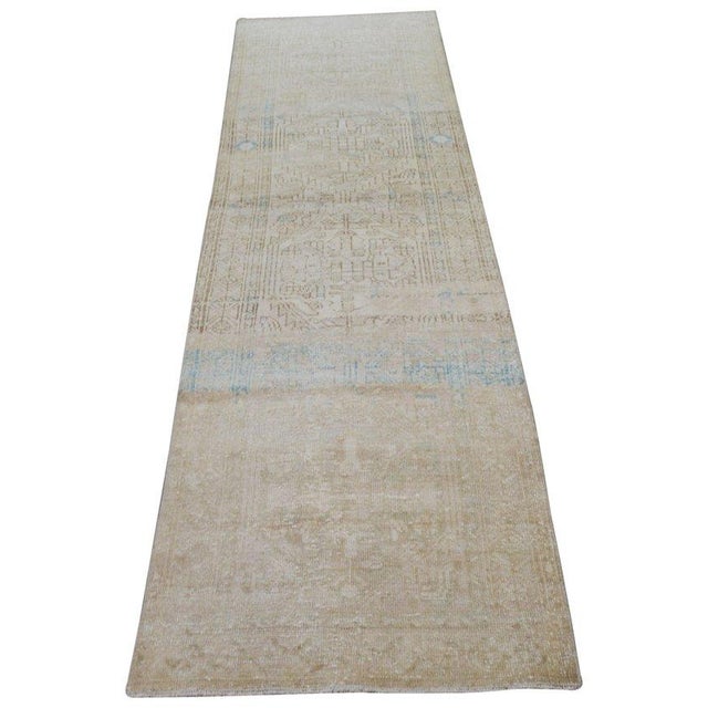 Hand-knotted with care using traditional rug-making techniques, this wool rug blends timeless craftsmanship with a modern...