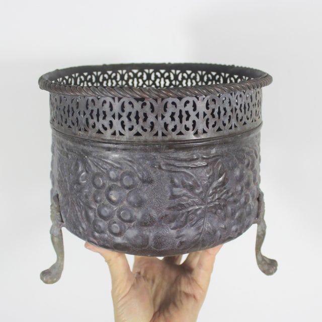 Vintage brass claw footed planter with raised grape motif, rope edge and pierced detail. This has a wonderful rich patina...