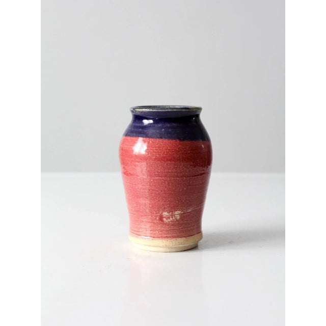This vintage studio pottery vase is a signed, handcrafted piece showcasing the individuality of the studio pottery...