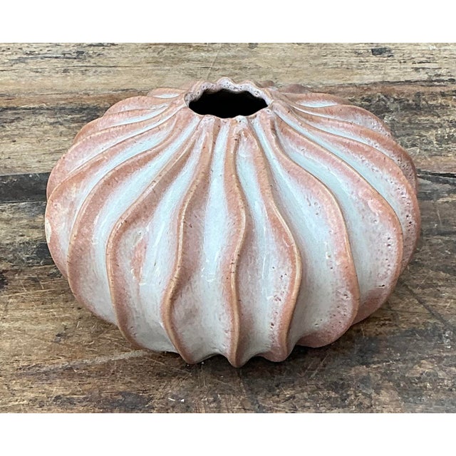 This original studio pottery vessel is a masterclass in organic modernism, offering a tactile and sculptural presence. Its...