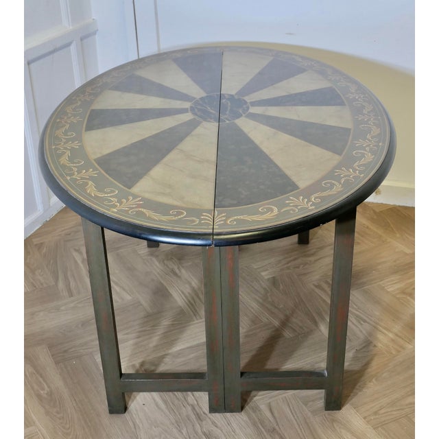 Simulated Marble Oval Table Painted by Graham Carr A rare and unusual piece, the table has a fold over top with swing...
