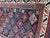 Nice late 19th century long Caucasian rug with natural colors and a beautiful tribal geometrical design. Entirely hand...