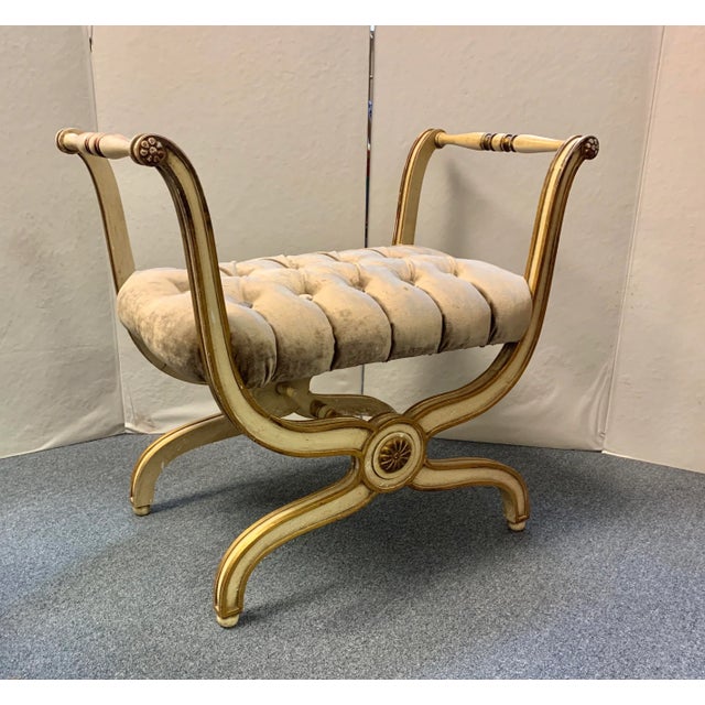 Hollywood Regency Carved Curule X Bench c1940's Features an aged Ecru and gold painted finish with a red umber glaze,...