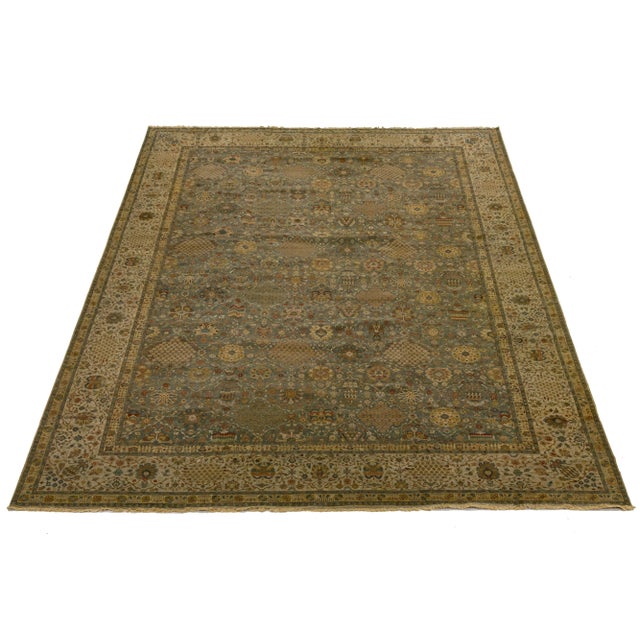 Discover the beauty of this elegant, Modern Tabriz-style hand-knotted wool rug, crafted with exceptional skill and...