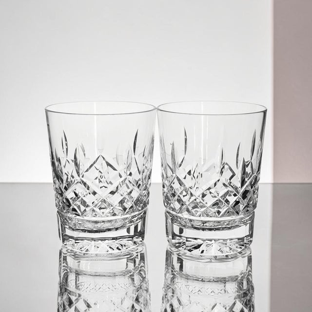 Set of two Waterford Crystal Lismore Double Old Fashioned glasses in the iconic Lismore pattern. Produced in Ireland, each...