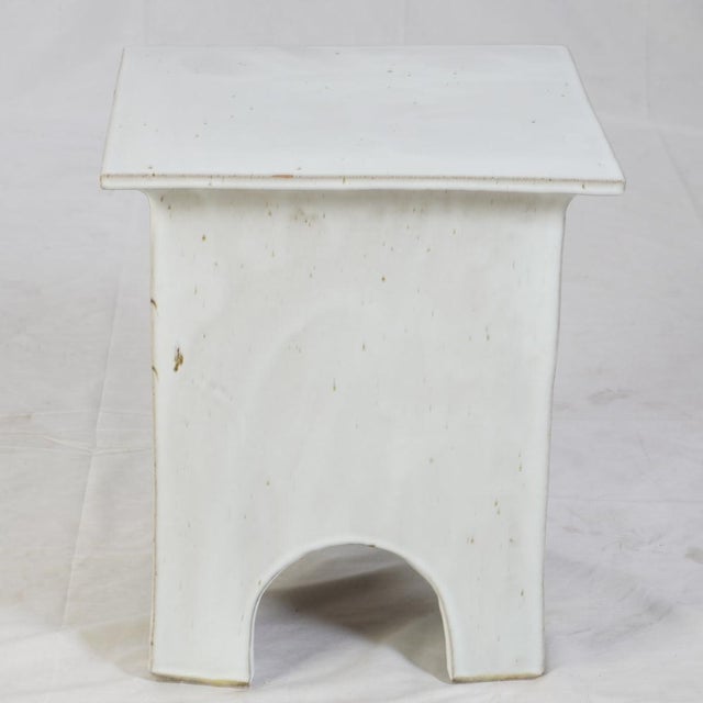 Modern and sculptural, this glazed ceramic garden stool adds an understated elegance to any space. Featuring a smooth...