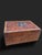 Rectangular box veneered in burl wood, with marquetry decoration on the lid (brass, ebony, and stained wood). European...