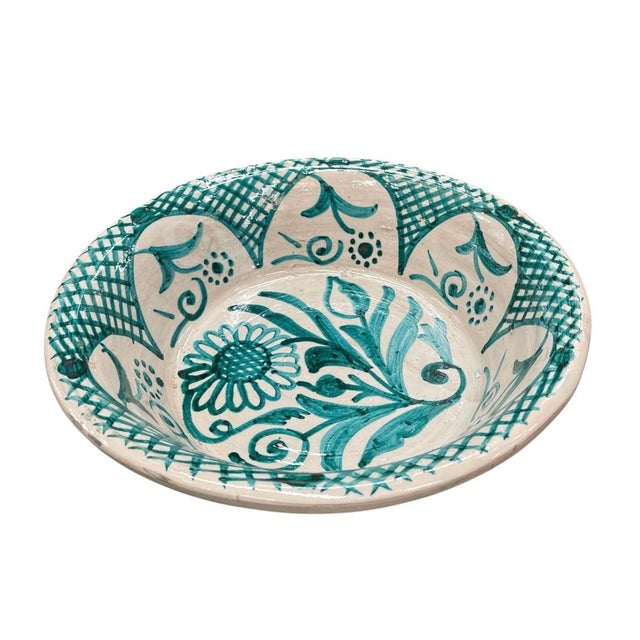 This striking vintage Moroccan ceramic bowl, or lebrillo, features a vibrant emerald green and creamy white palette,...