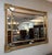 This Friedman Brothers-attributed Neoclassical wall mirror features a gilt frame with carved rosette accents, rope-twist...