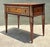 This vintage console table by Alphonse Marina exemplifies refined mid-century craftsmanship through its carved wood...