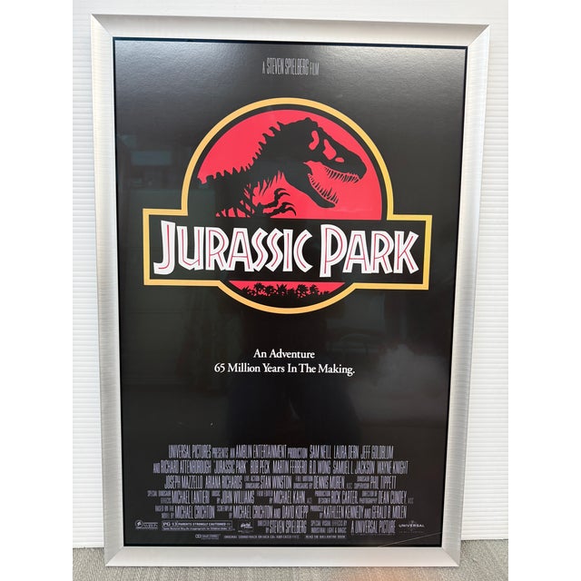 Design Plus Gallery presents a Framed Cinematic Movie Poster of Jurassic Park. The iconic Jurassic Park (1993) movie...