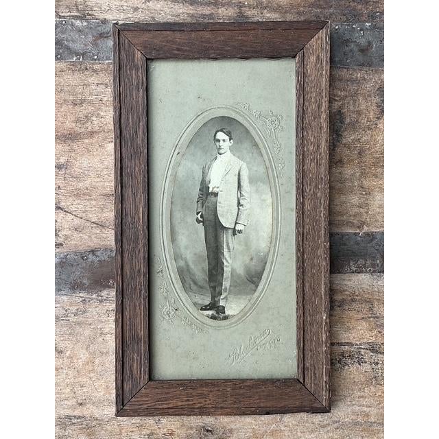 This striking original antique photograph captures the dignified elegance of the early 20th century. The full-length...