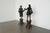 This vintage pair of large figural statues draws inspiration from 19th-century European decorative arts, presenting a...