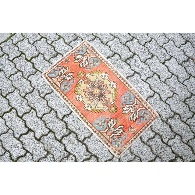 This is a vintage Turkish Oushak rug from the 1960s. The piece was hand-knotted.