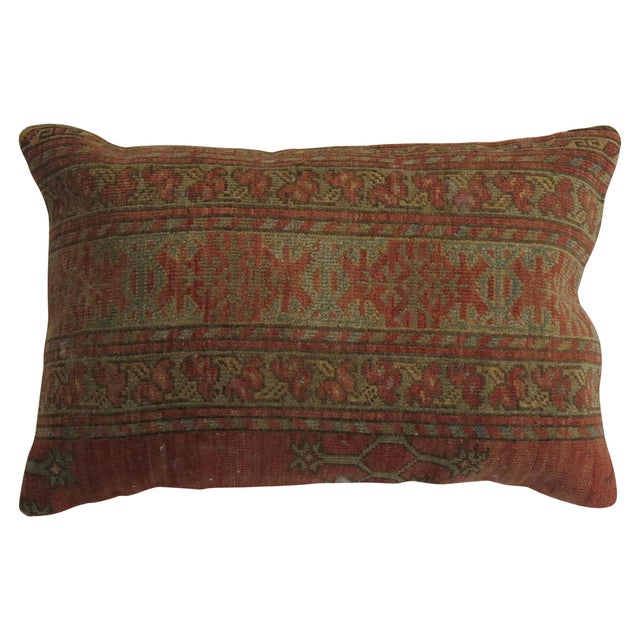 Pillow made from a 19th century antique Ersari rug with cotton back and zipper closure. Measures: 15'' x 23''.