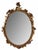 An exceptional 19th century French hand-carved giltwood mirror of outstanding craftsmanship, showcasing the elegance and...