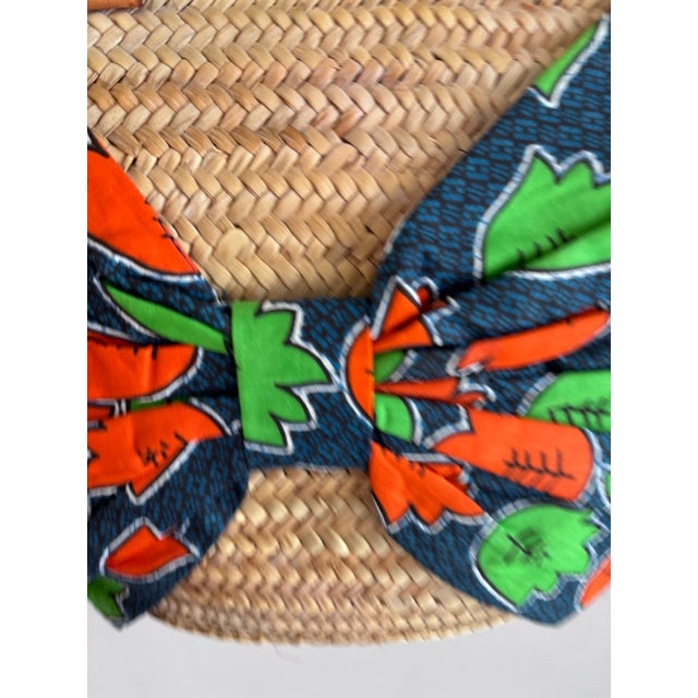 A Giselle Handwoven Straw Basket / Tote Featuring a Large Bow Made From Colorful Print and Brown Leather Shoulder Straps. For Sale - Image 9 of 12