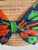 A Giselle Handwoven Straw Basket / Tote Featuring a Large Bow Made From Colorful Print and Brown Leather Shoulder Straps. For Sale - Image 9 of 12