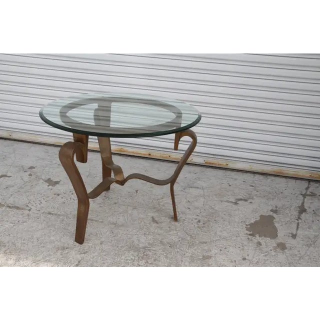 An elegant Vintage metal Round Coffee Table with a thick glass top. Understated in its simplicity the forging of this...