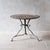 Antique French Arras bistro table made of cast iron and wrought iron, dating from the late 19th century. The round metal...