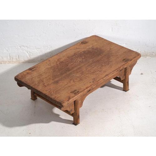 Antique low table in pine wood, traditional Chinese furniture originating from Shanxi and dated circa 1930. Originates...