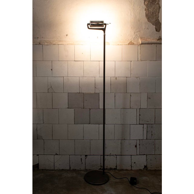 Floor lamp in aluminum and chromed steel, with plastic details. Filoti model Designer Piero Lissoni Manufacturer Artemide...