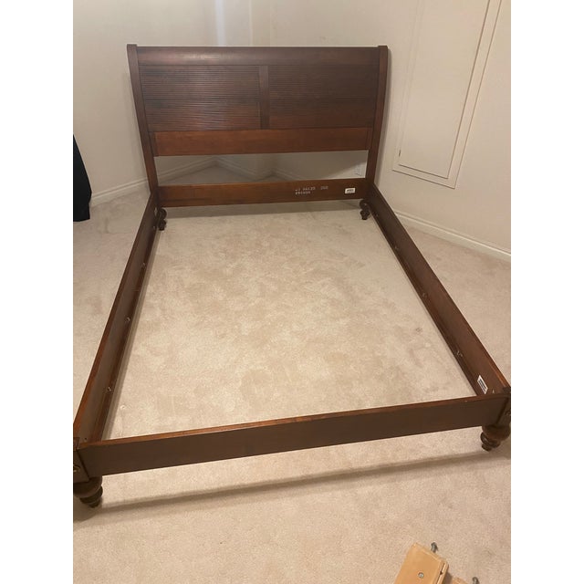 Late 20th Century Ethan Allen British Classics Queen Sleigh Bed with low foot board "Cayman". Intricately carved details...