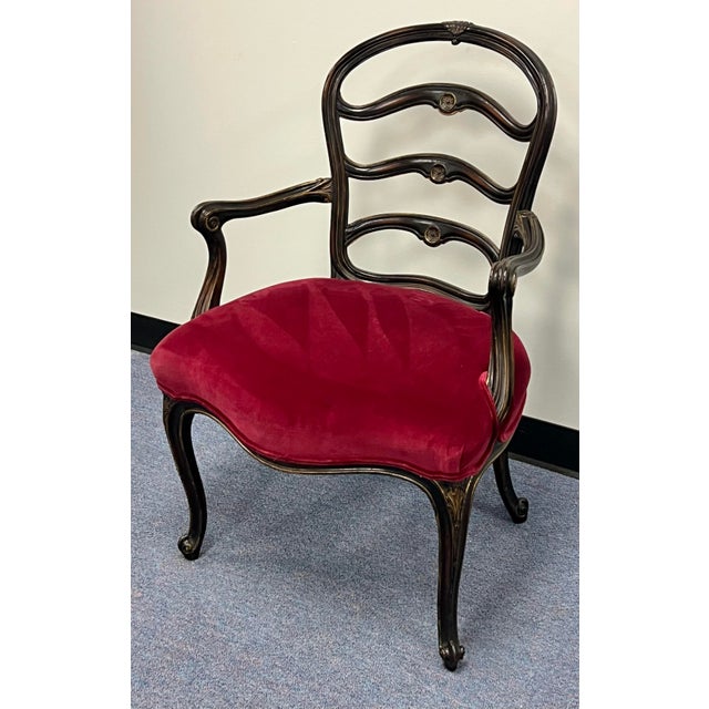 Striking carved antique French Ladderback armchair. Gracefully arched and curved ladders anchored by the carved arms...