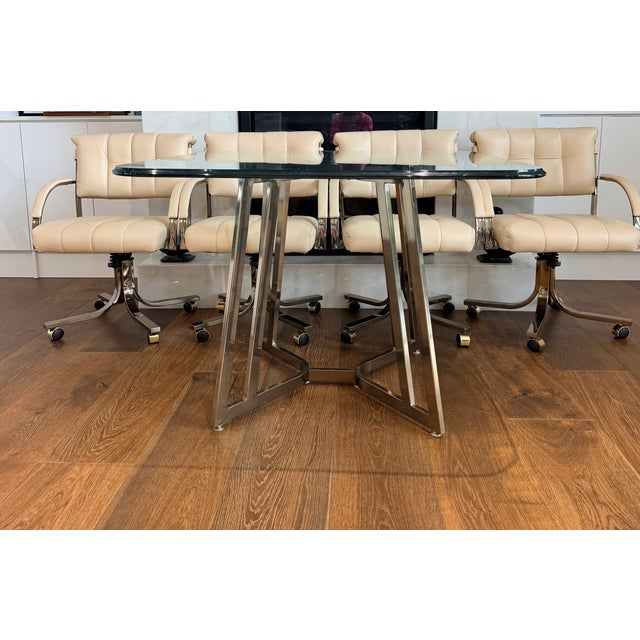 An exceptionally stylish vintage dining set by Cal-Style Furniture Manufacturing Co. of Compton, California, showcasing a...