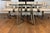 An exceptionally stylish vintage dining set by Cal-Style Furniture Manufacturing Co. of Compton, California, showcasing a...