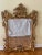 Vintage 20th Century Italian Rococo Style giltwood wall mirror with extensive foliate carved filigree frame with floral...