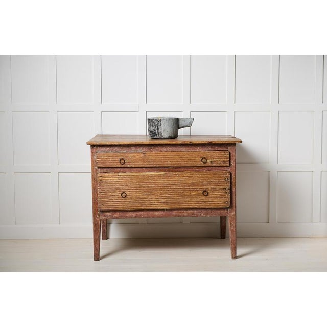 Rustic antique chest of drawers from northern Sweden. This rustic folk art furniture is made by hand in solid pine around...