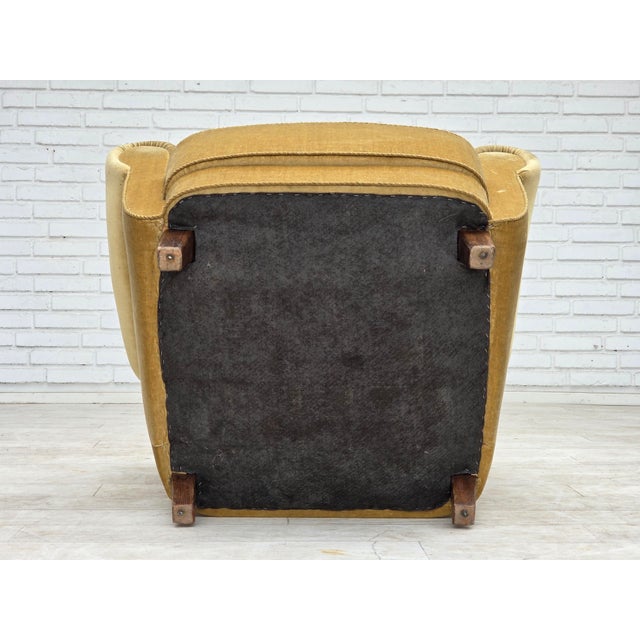 1960s, Danish relax armchair. Original light green furniture velour, oak wood legs, brass springs in the seat. Original...