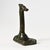 Danish art deco bronze giraffe-shaped corkscrew with bottle opener. Marked on the base: Eneret / Bronce / Kai Stage. This...