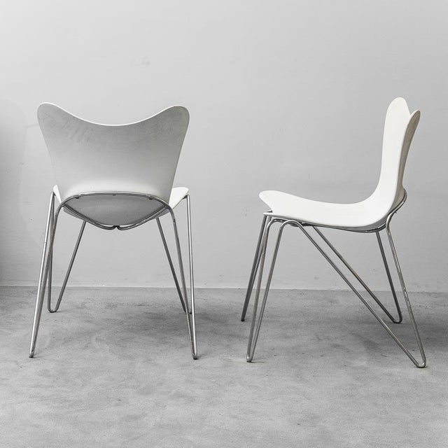 Set of 4 Trip chairs. Designed by Casprini and produced by Ziliani in the 2000s. Metal frame with plastic seat. Signs of...