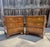 Three drawer bedside chests in the Chippendale style made by Henredon circa 1970's. Made with walnut veneers and brass...