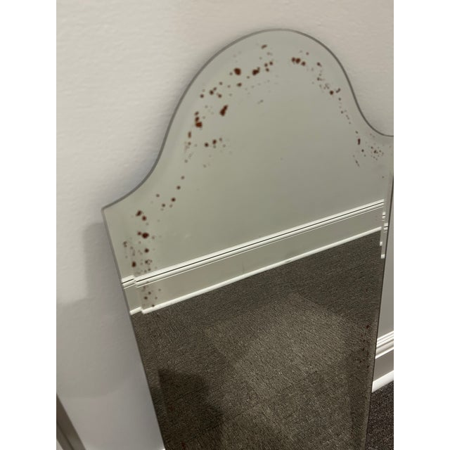 A frameless, arch-top Pottery Barn mirror with beveled edges throughout. Over time, the mirror glass has developed a...