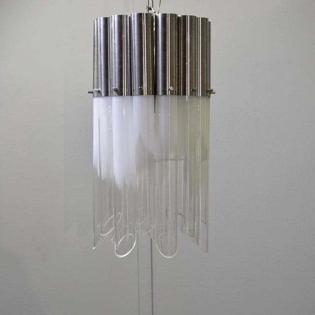 Pendant chandelier attributed to Carlo Nason, composed of 14 tubular glass elements with steel bases. The chandelier is...