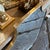 A shield shaped brass wall mirror designed and manufactured in Italy in the Sixties in the style of Giò Ponti, mirror is...