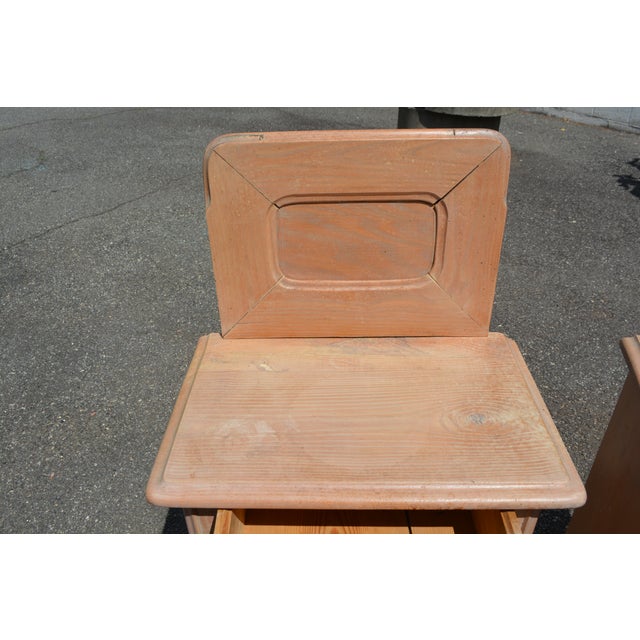 This is a neat looking pair of wooden nightstands. I believe they are pine. Single dovetailed drawer & cupboard with...