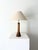 A striking table lamp formed from a vintage industrial loom spool, featuring concentric rings to the conical base. Solid...