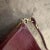 This elegant 1950s Italian shoulder bag exudes timeless sophistication with its rich burgundy leather and classic lizard-...