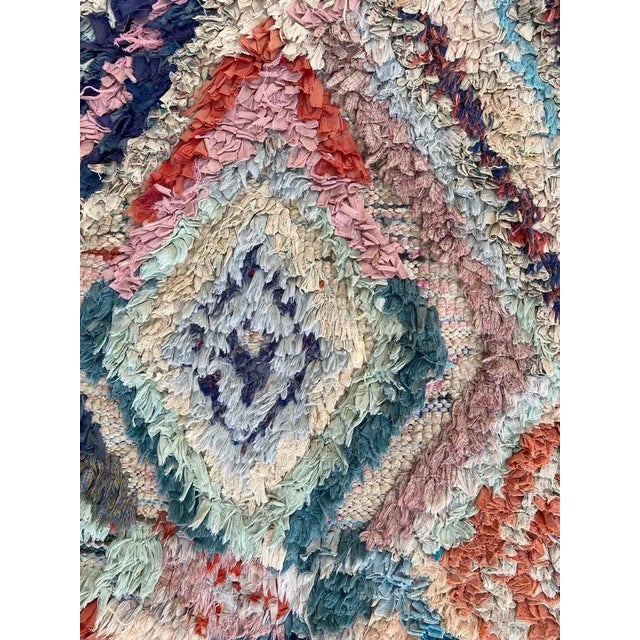 Beautiful tribal Moroccan Boucherouite rug with nice geometric design and beautiful colors, entirely hand knotted with...